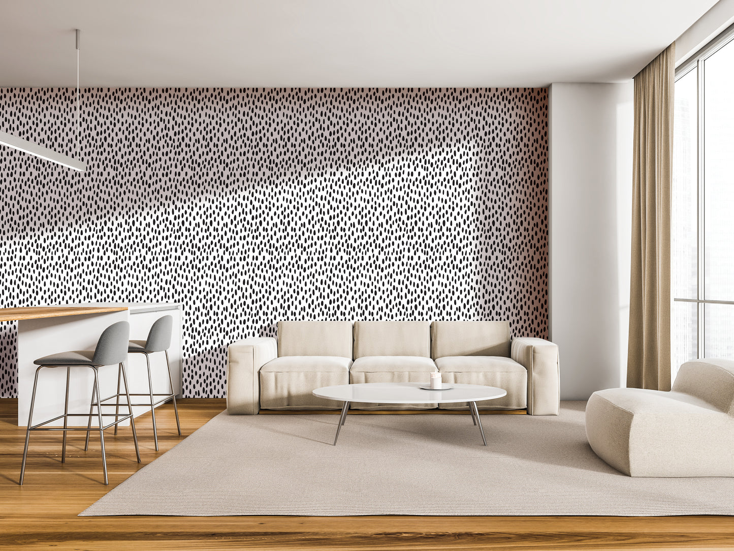 a modern living room with a white sofa, a round coffee table, and a barstool. The room has a neutral color scheme with a black and white patterned accent wall, and the furniture is arranged to create a comfortable and inviting atmosphere.