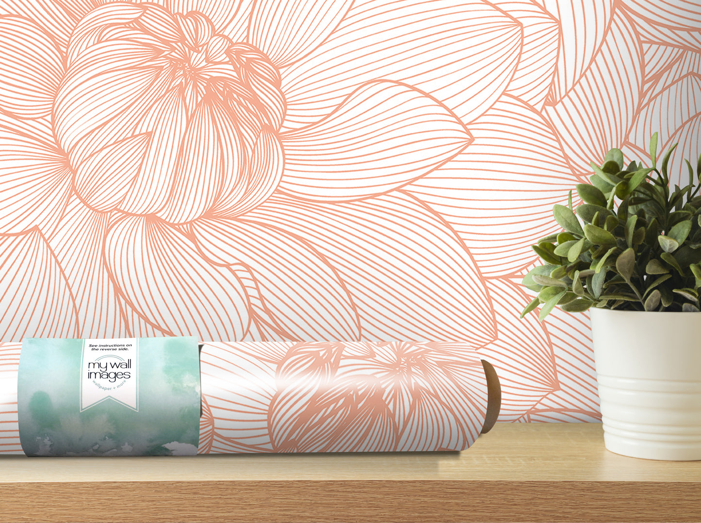 a wallpapered wall with a large floral pattern, a potted plant, and a roll of wallpaper on a shelf.