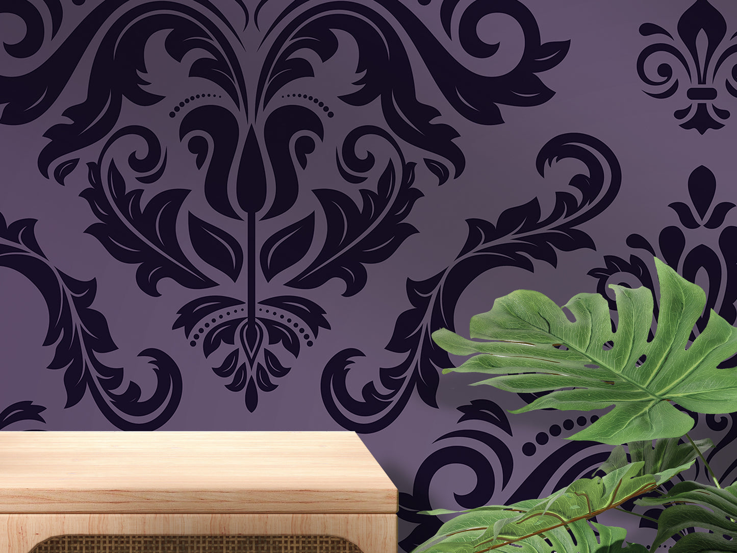 a purple wall with a black and white damask pattern, a wooden table, and a large green plant.