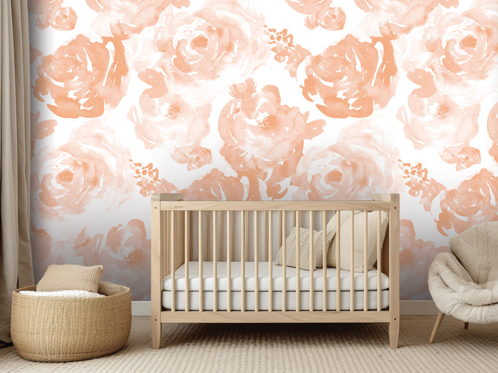 a nursery room with a wooden crib, a woven basket, and a plush chair. The walls are decorated with a floral wallpaper in shades of peach and white.