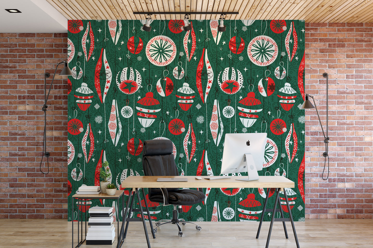 a modern office space with a large wallpapered wall adorned with a festive Christmas pattern. In the center of the room, there is a wooden desk with a computer monitor, a chair, and a potted plant. The office appears to be well-lit and organized, with a brick wall and a wooden ceiling providing a warm and inviting atmosphere.