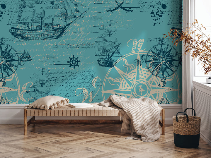 a room with a large wall mural depicting nautical scenes, including ships, a compass, and other maritime elements. The room has a wooden floor and a bench with pillows, and there is a woven basket on the floor next to the bench.