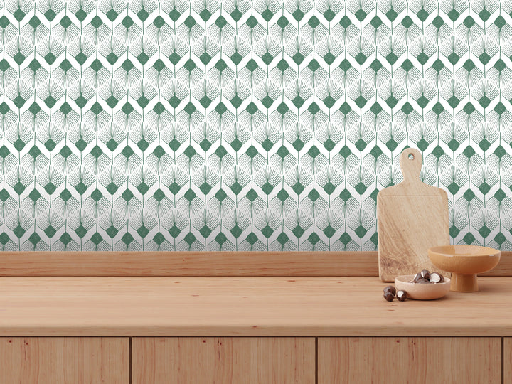 a wooden table with a wooden cutting board, a bowl, and a small dish on it. The table is set against a wall with a repeating pattern of green and white geometric shapes.