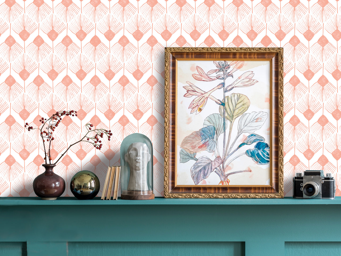 a shelf with various decorative items, including a framed picture, a vase with flowers, a glass dome, a camera, and a few books. The shelf has a teal color and is set against a pink and white patterned wallpaper.