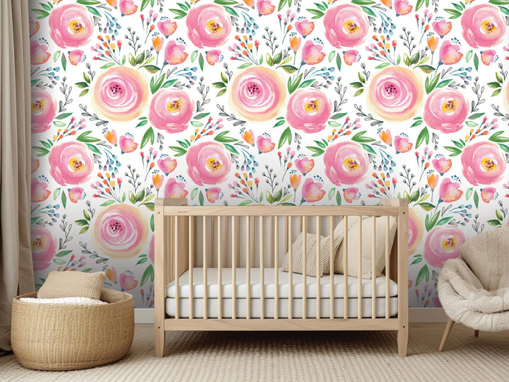a nursery room with a wooden crib, a woven basket, and a plush chair. The walls are decorated with a floral wallpaper pattern in shades of pink and white, creating a warm and inviting atmosphere.
