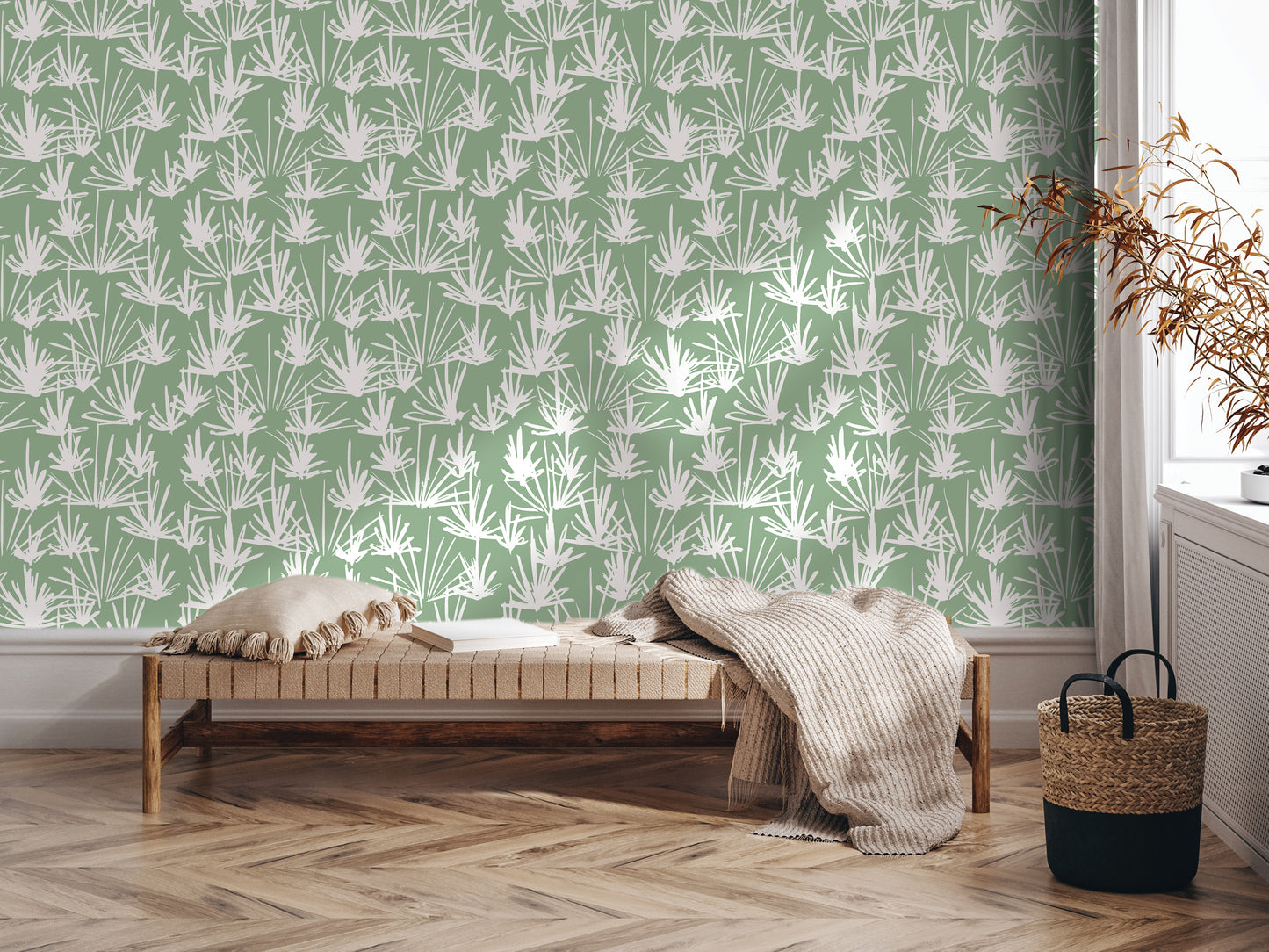 a modern living room with a green and white patterned wallpaper on the wall behind a wooden bench. The bench is adorned with a throw blanket and a woven basket, adding a cozy touch to the space. The room is well-lit, with natural light coming in from a window, creating a warm and inviting atmosphere.