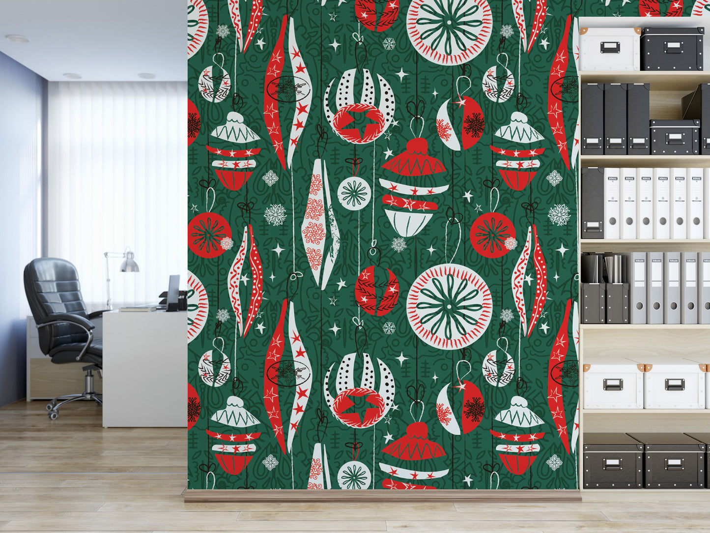 a wall with a vibrant, colorful pattern of Christmas ornaments and decorations in shades of green, red, and white. The pattern is displayed on a green background, creating a festive and holiday-themed atmosphere. In the background, there is a bookshelf filled with various books and binders, suggesting a workspace or study area.