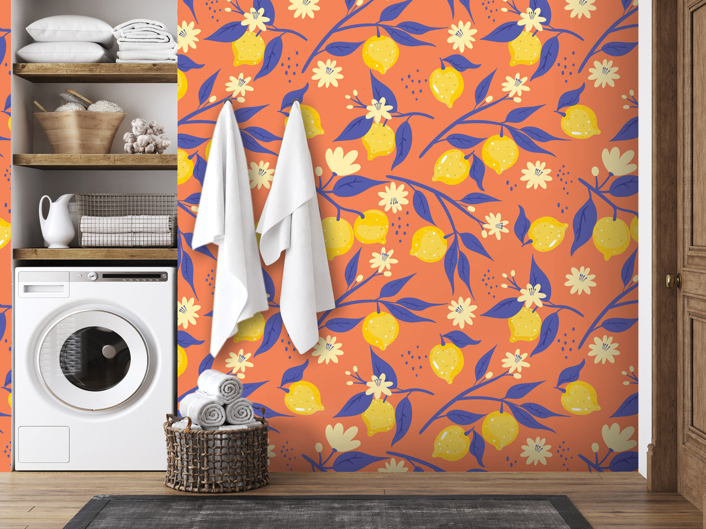 a bathroom with a vibrant orange and blue floral pattern on the wall, complemented by white towels and a basket of rolled-up towels.
