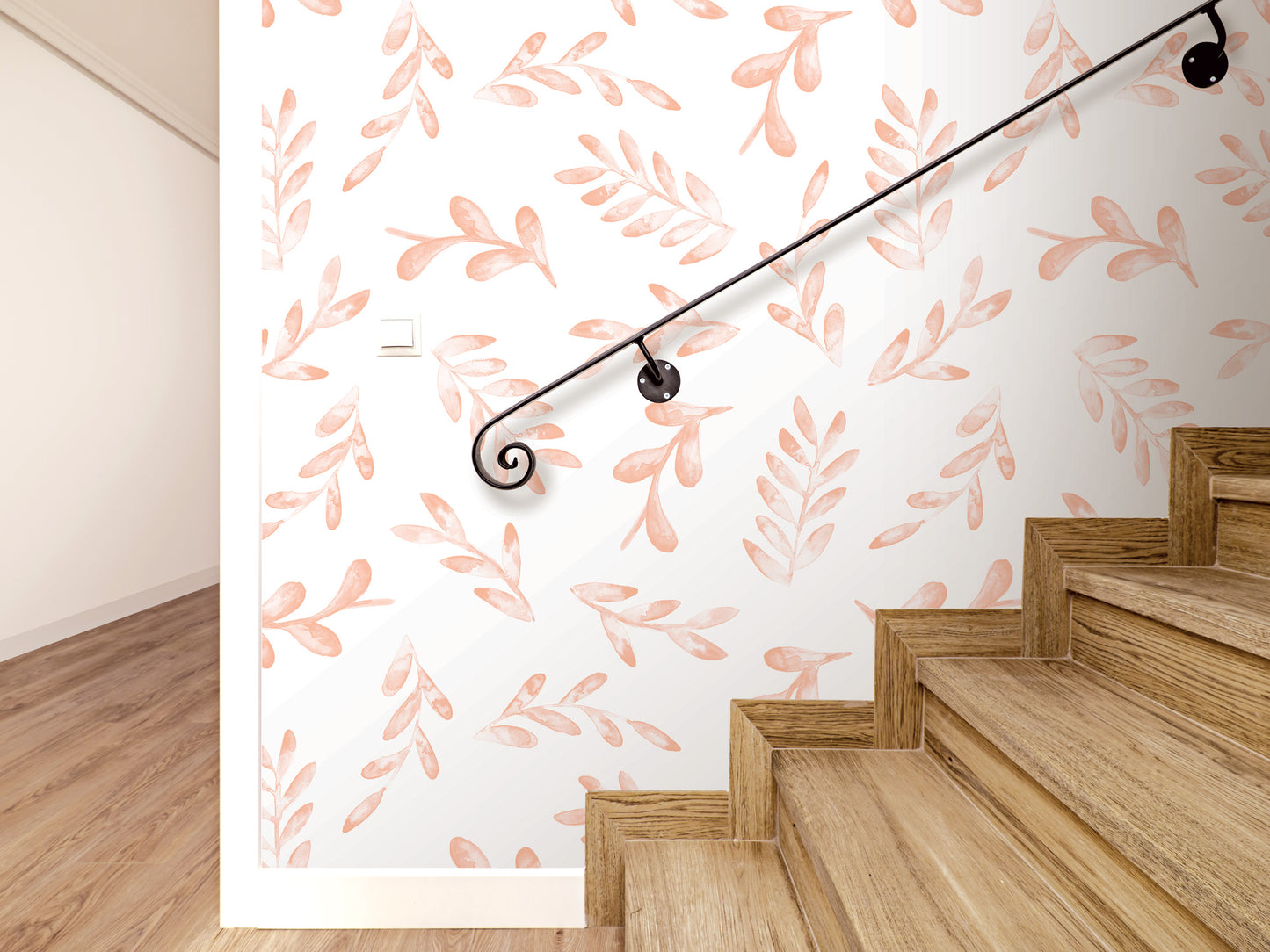 a staircase with a black handrail, and the wall behind it has a repeating pattern of orange leaves.