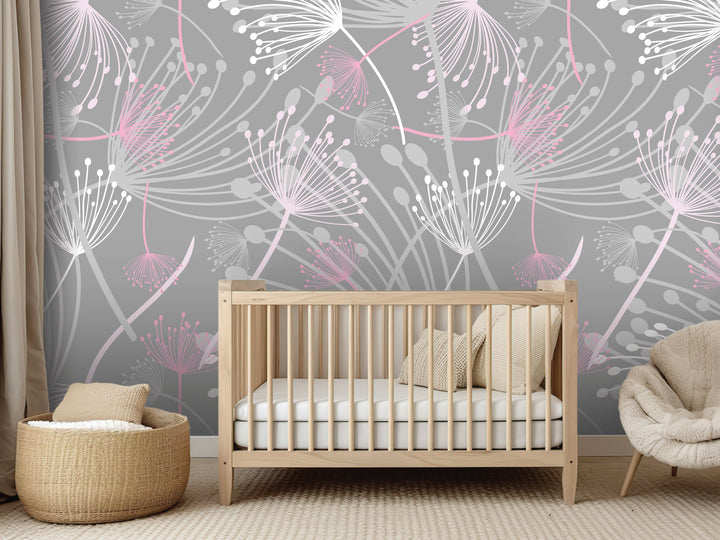 a nursery room with a wooden crib, a woven basket, and a plush chair. The walls are decorated with a gray and pink floral pattern, creating a serene and calming atmosphere.