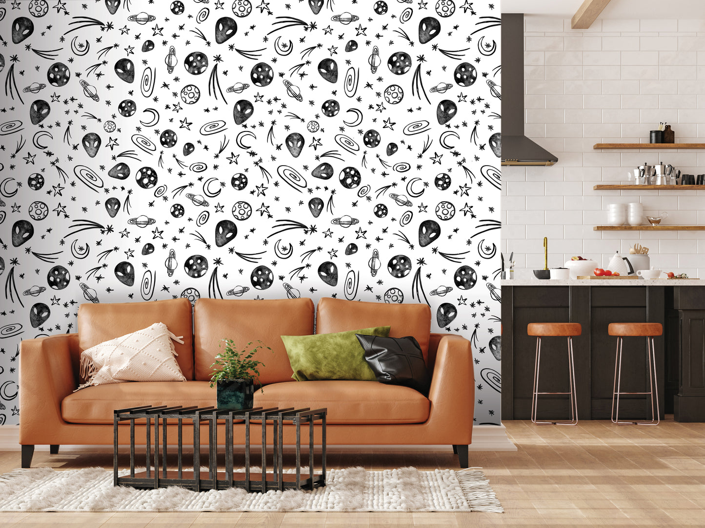 a modern living room with a large wall mural depicting various space-themed elements, including planets, stars, and comets. The room is furnished with a brown leather sofa, a coffee table, and a kitchen counter with stools.