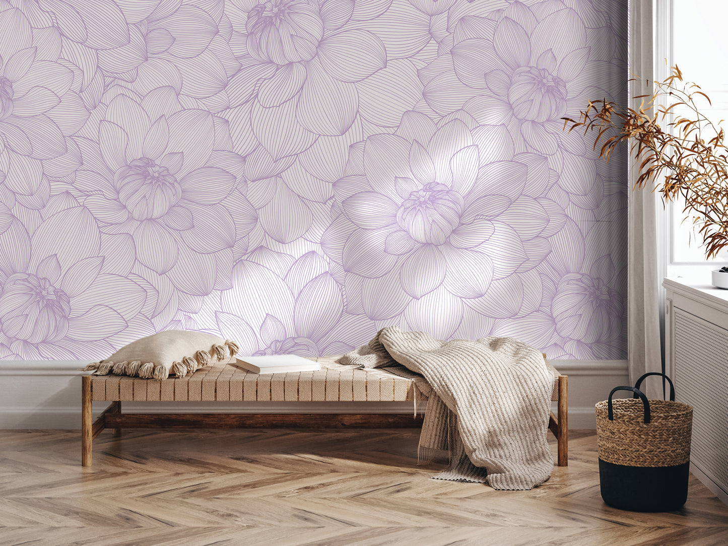 a cozy and inviting living space with a plush bench, a woven basket, and a decorative plant. The bench is positioned against a wall adorned with a large, intricate floral pattern in shades of purple and white, creating a serene and calming atmosphere.