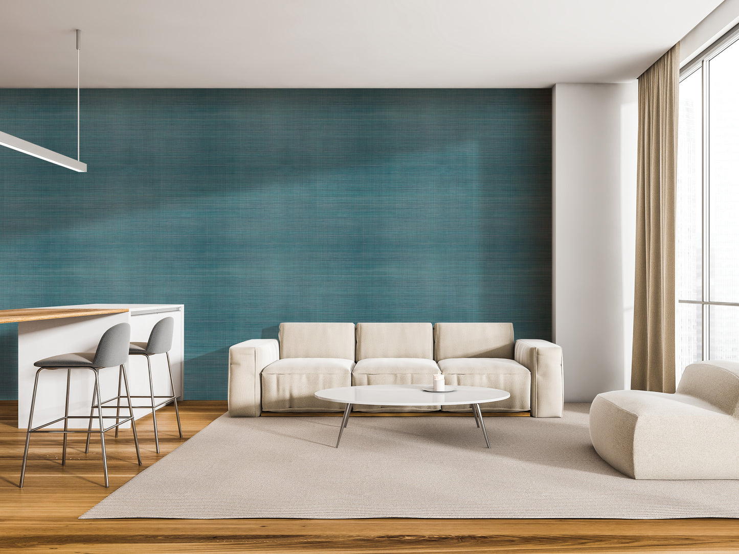 a modern living room with a white sofa, a round coffee table, and a bar with stools. The room has a blue accent wall and a large window, creating a bright and airy atmosphere.