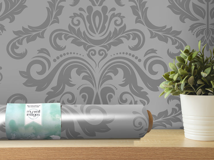 a gray and white damask wallpaper with a potted plant on a shelf.