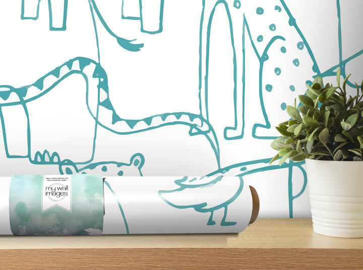 a roll of wallpaper with a watercolor-style drawing of a giraffe and a panda on it, placed on a wooden shelf next to a potted plant.