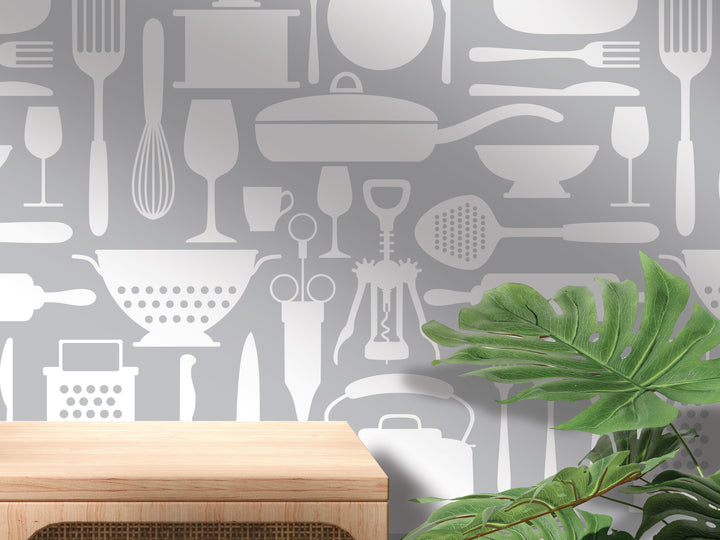 a wall with a repeating pattern of various kitchen utensils and appliances, including a wooden table, a plant, and a wooden shelf.