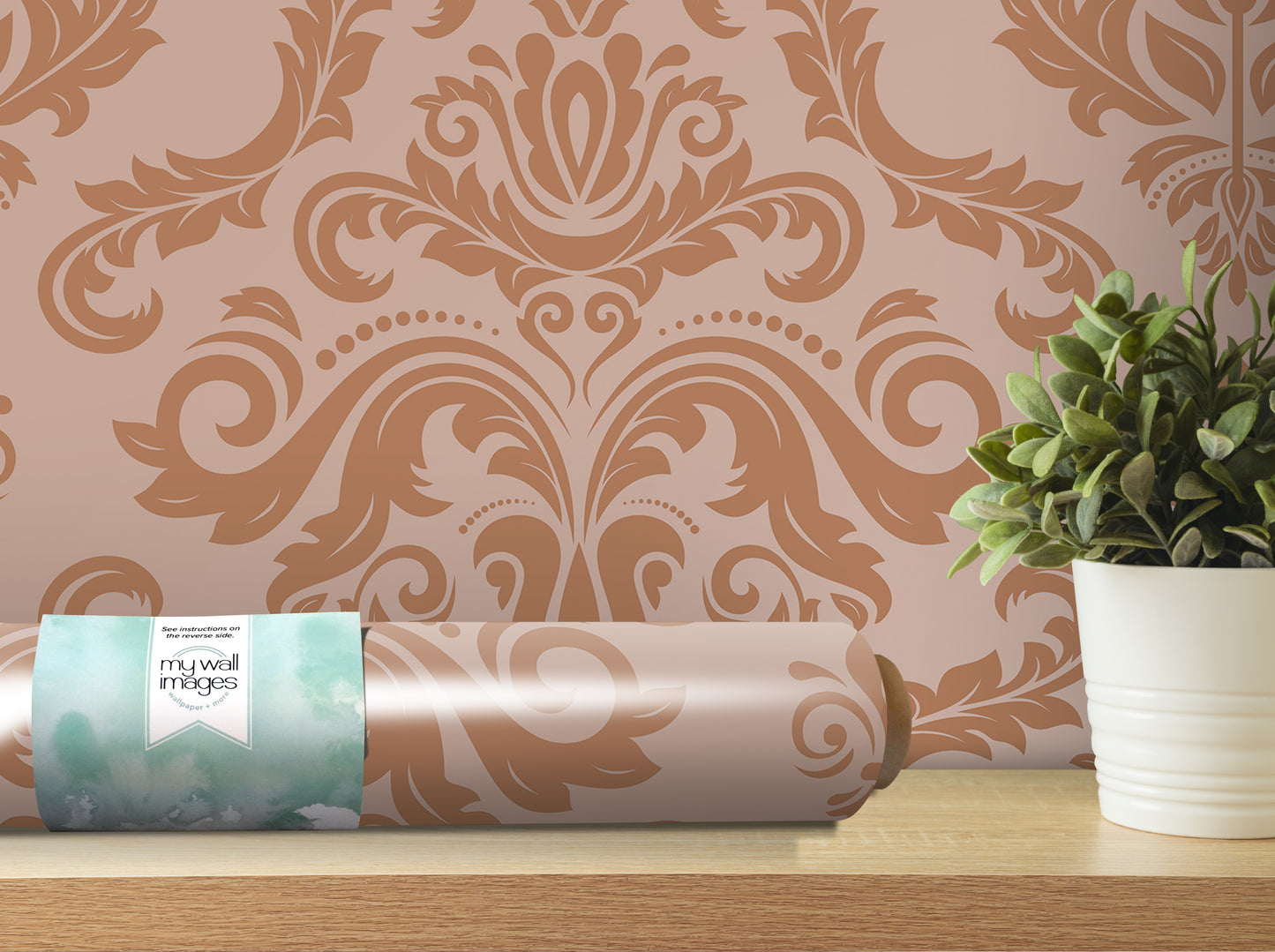 a decorative wallpaper with a floral pattern, a potted plant, and a roll of wallpaper on a shelf.