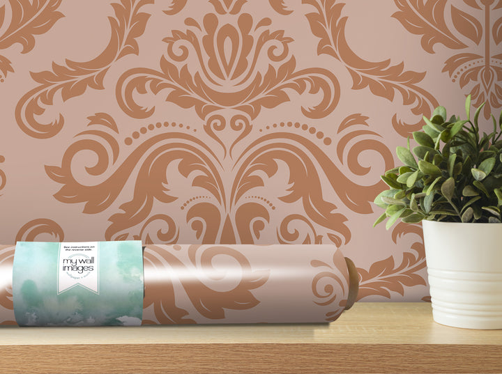 a decorative wallpaper with a floral pattern, a potted plant, and a roll of wallpaper on a shelf.