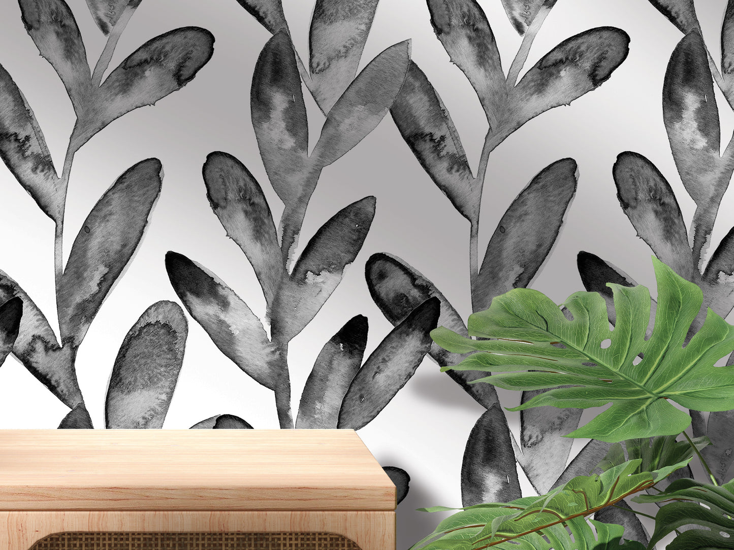 a black and white wallpaper with a repeating pattern of stylized leaves and a wooden table in the foreground.