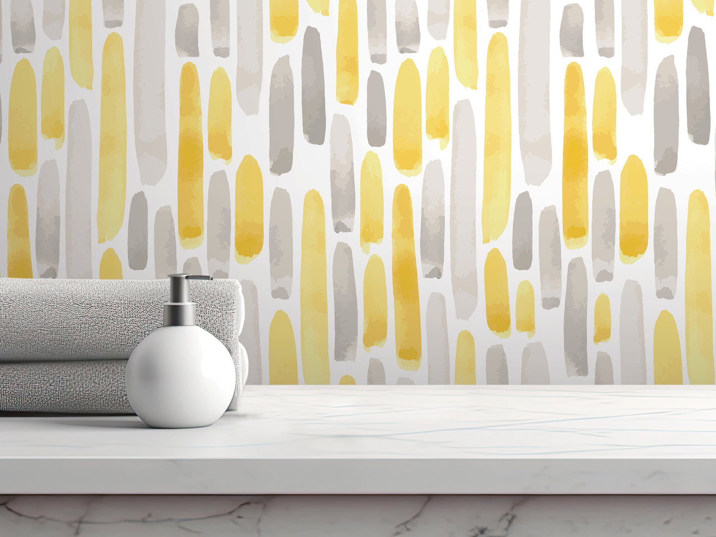 a white countertop with a white soap dispenser and a stack of gray towels. The backdrop is a wall with a repeating pattern of yellow and gray brushstrokes.