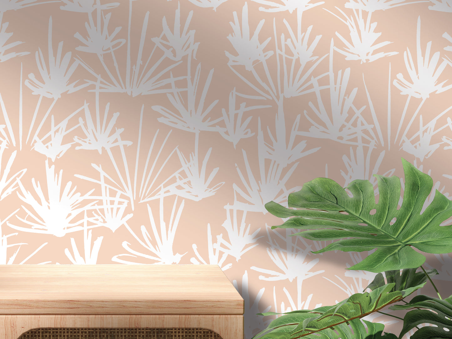 a wooden table with a plant on top of it, set against a wall with a repeating pattern of white leaves and stems.