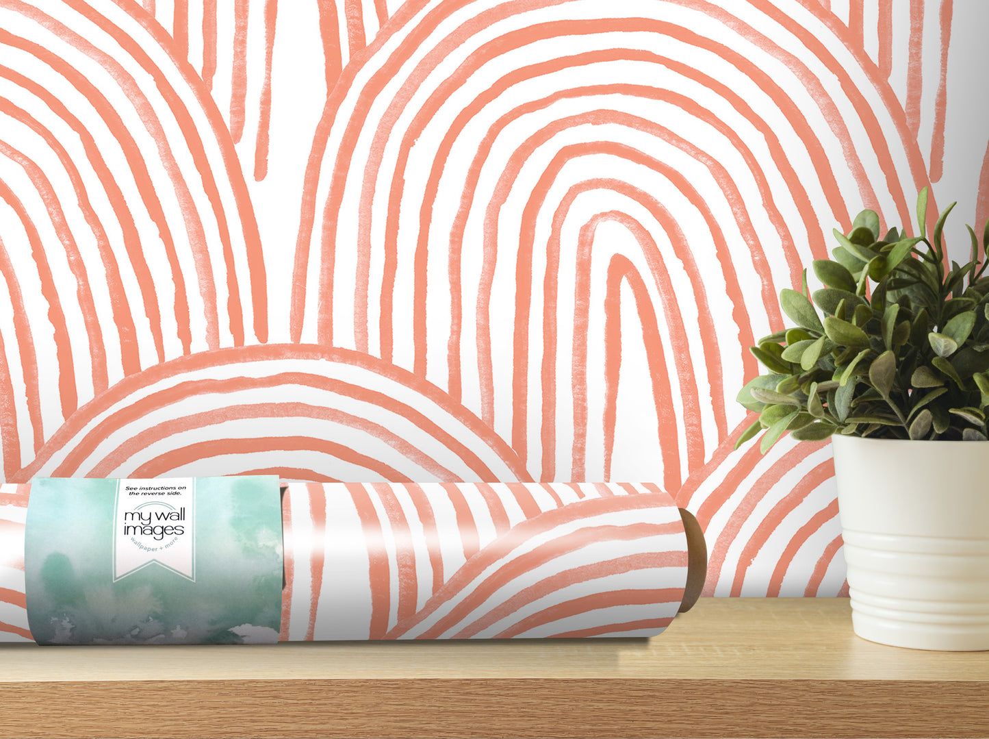 a wall with a striking pattern of orange and white stripes, and a potted plant placed on a wooden surface next to the wall.