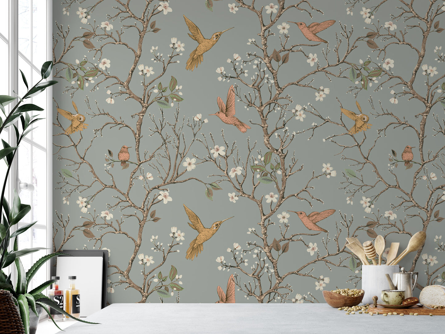 a wallpapered wall with a repeating pattern of birds and flowers, including hummingbirds and blossoms, creating a lively and nature-inspired atmosphere.