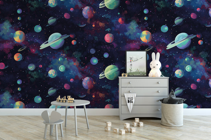 a child's bedroom with a colorful, space-themed wallpaper. The room includes a dresser, a small table, and a toy bunny.
