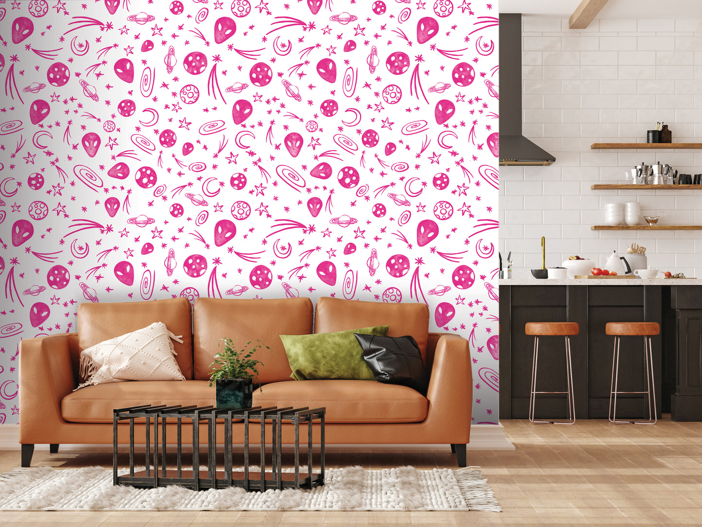 a living room with a brown leather couch, a coffee table, and a kitchen area with a counter and stools. The wall behind the couch is decorated with a pink and white pattern featuring various shapes, including stars, hearts, and balloons.