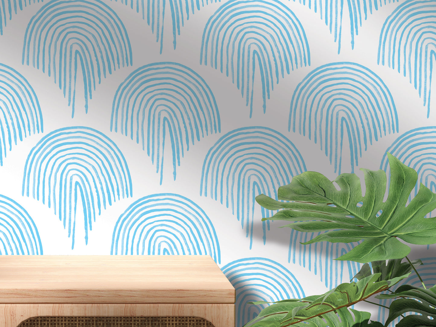a wooden table with a plant on top of it, set against a wall with a repeating pattern of blue and white arches.