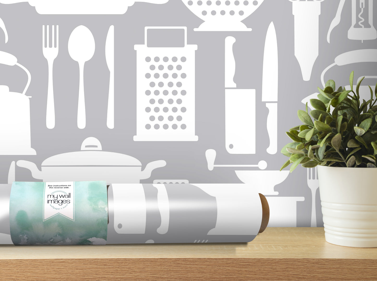 a kitchen-themed wallpaper with various kitchen utensils and appliances, such as a knife, spoon, and grater, as well as a potted plant.