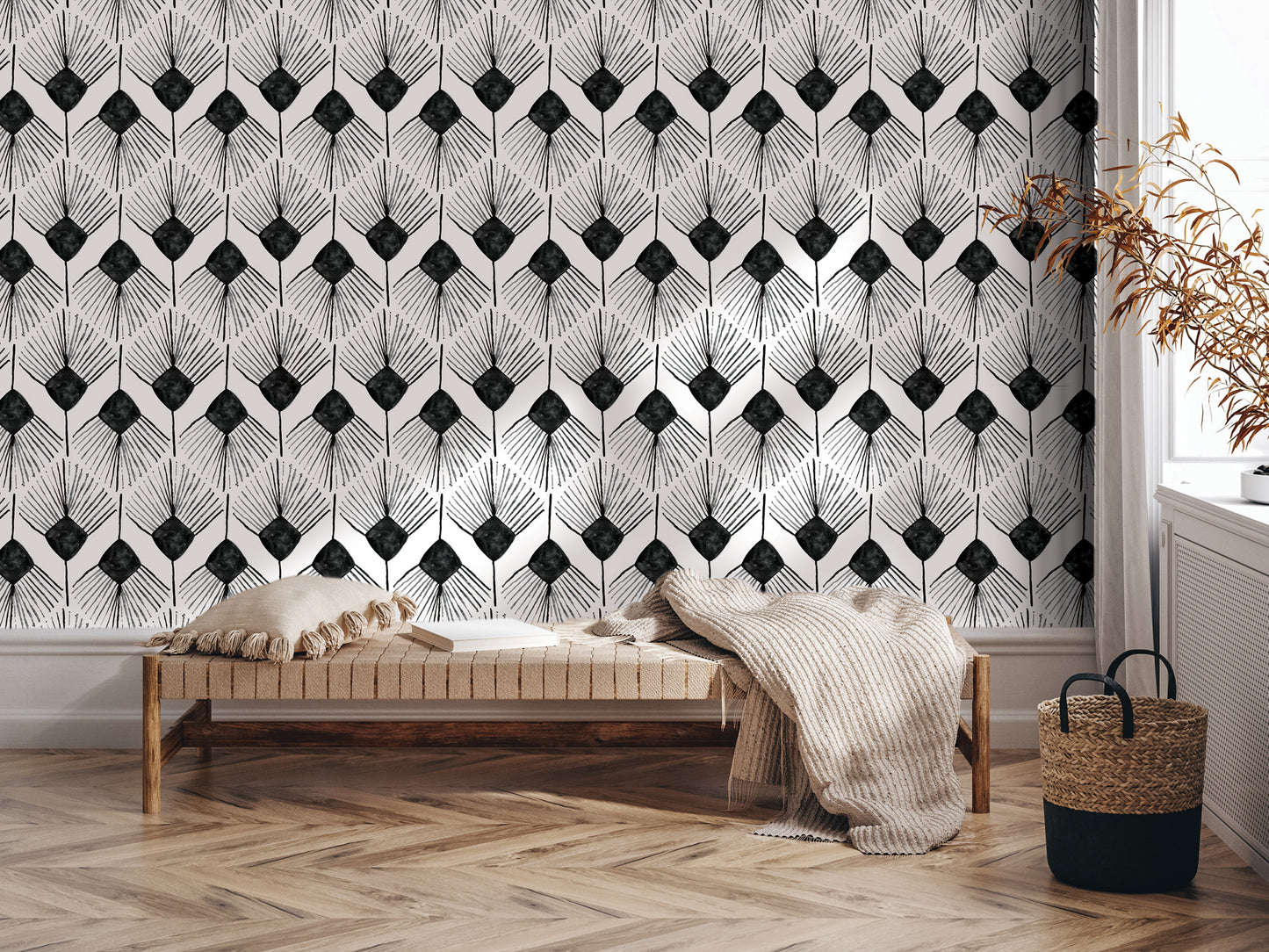 a modern living room with a black and white geometric pattern wallpaper on the wall behind a wooden bench. The bench is positioned in front of a window, and there is a woven basket nearby.