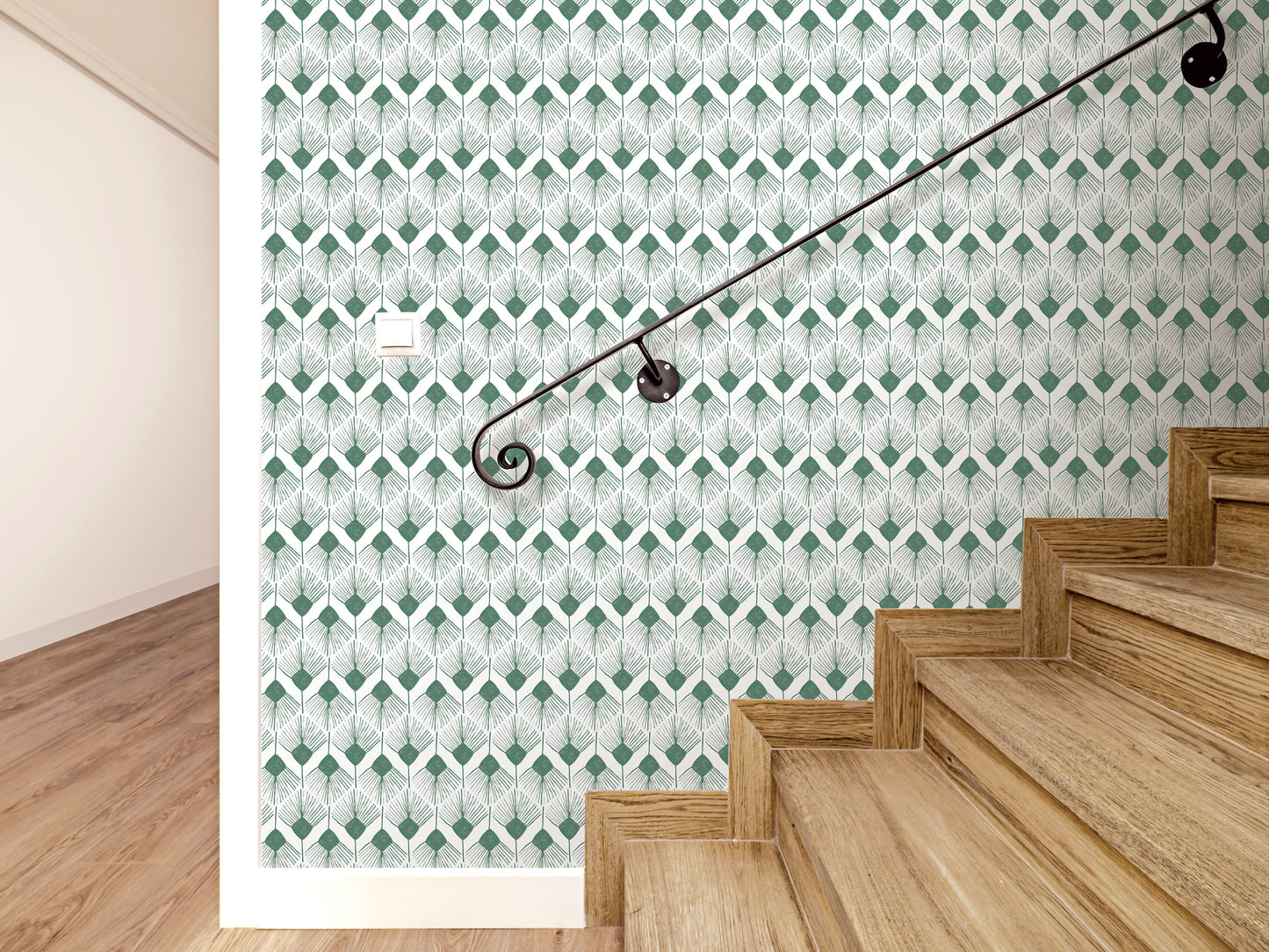 a staircase with wooden steps and a black metal handrail. The wall behind the stairs has a repeating pattern of green and white geometric shapes.