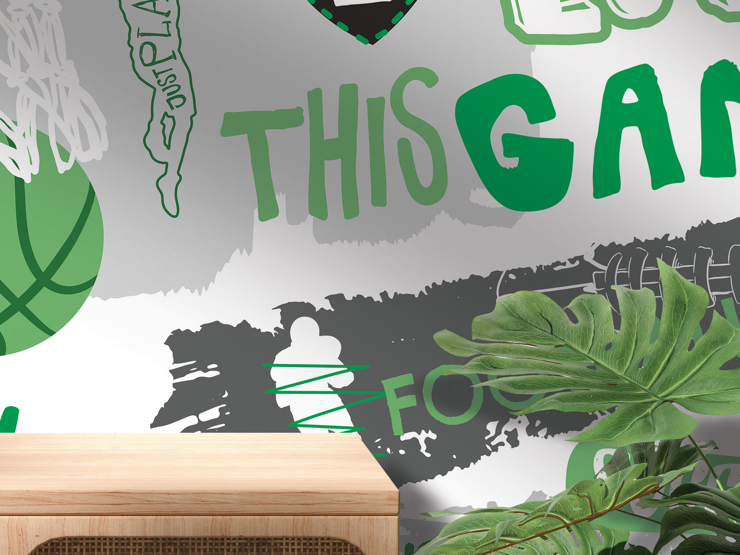The image is a wall mural with various elements, including a basketball, a person, and some text. The text appears to be a mix of words and phrases, and the overall composition suggests a collage of multiple images. The wall is decorated with green and white colors, and there are some plants visible in the foreground.