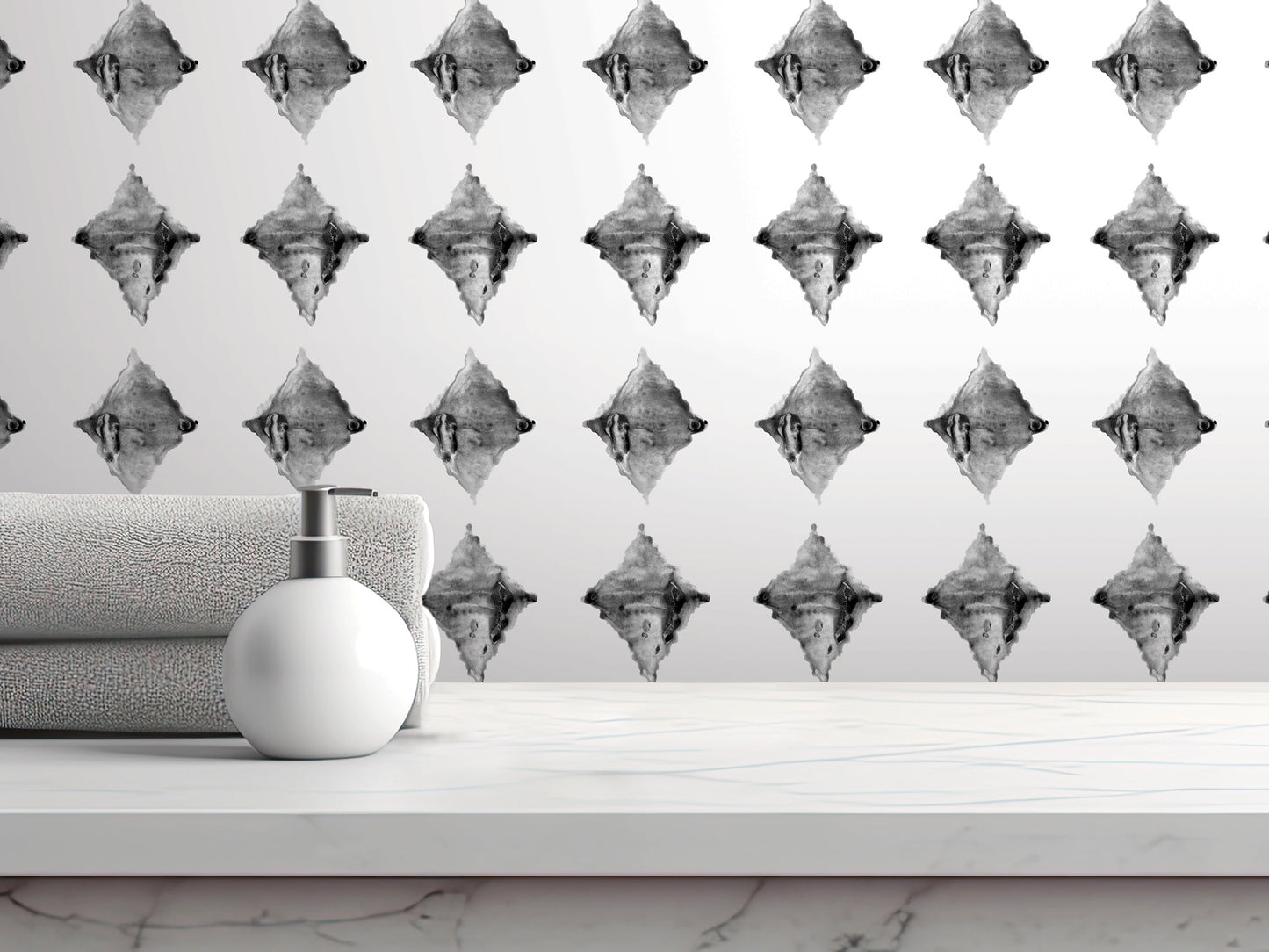 a white countertop with a white soap dispenser and a folded towel, set against a wall with a repeating diamond pattern.