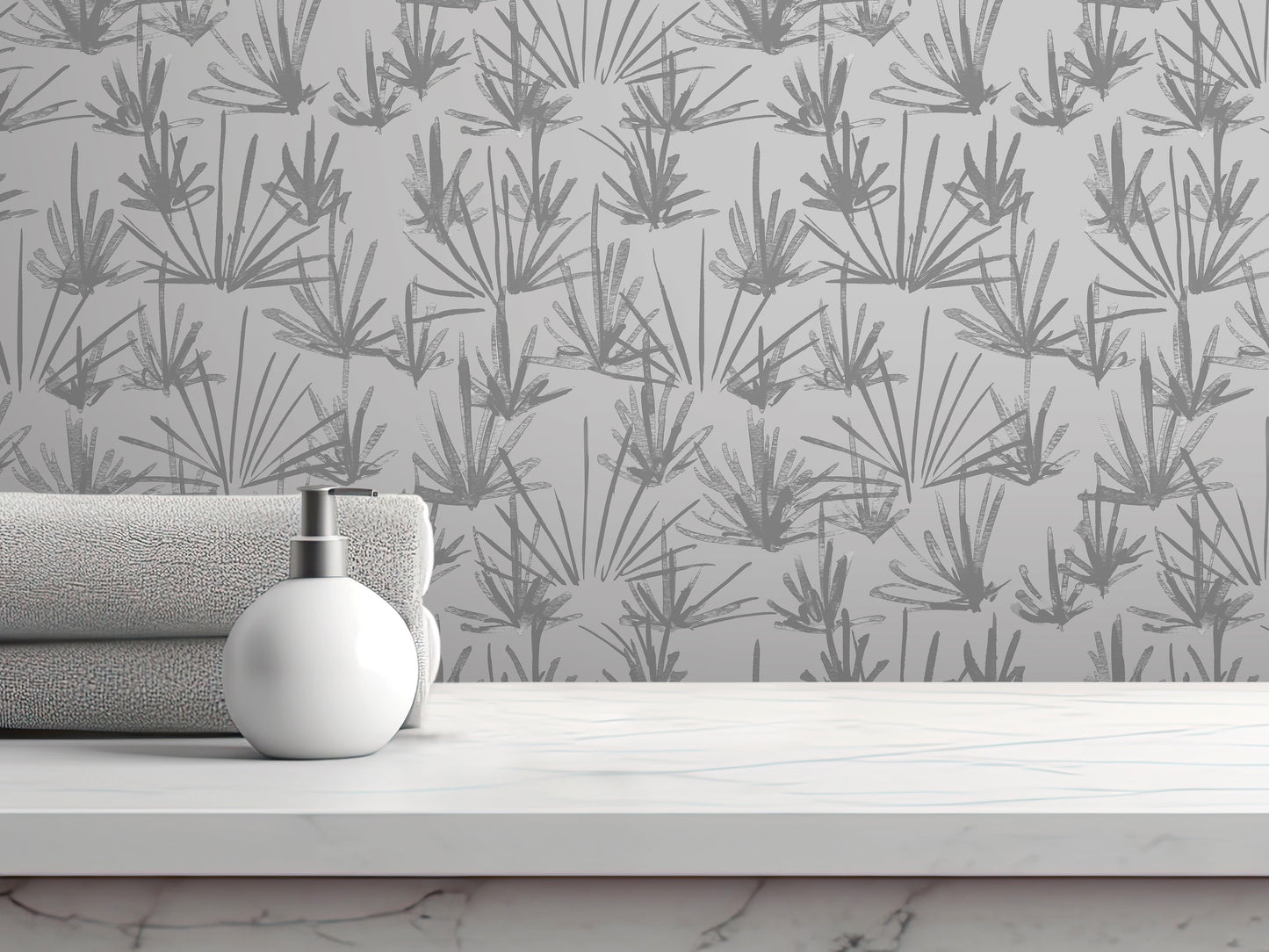 a white soap dispenser on a white countertop, with a gray towel and a white bottle of lotion placed next to it. The background is a gray wall with a repeating pattern of stylized plants or flowers.