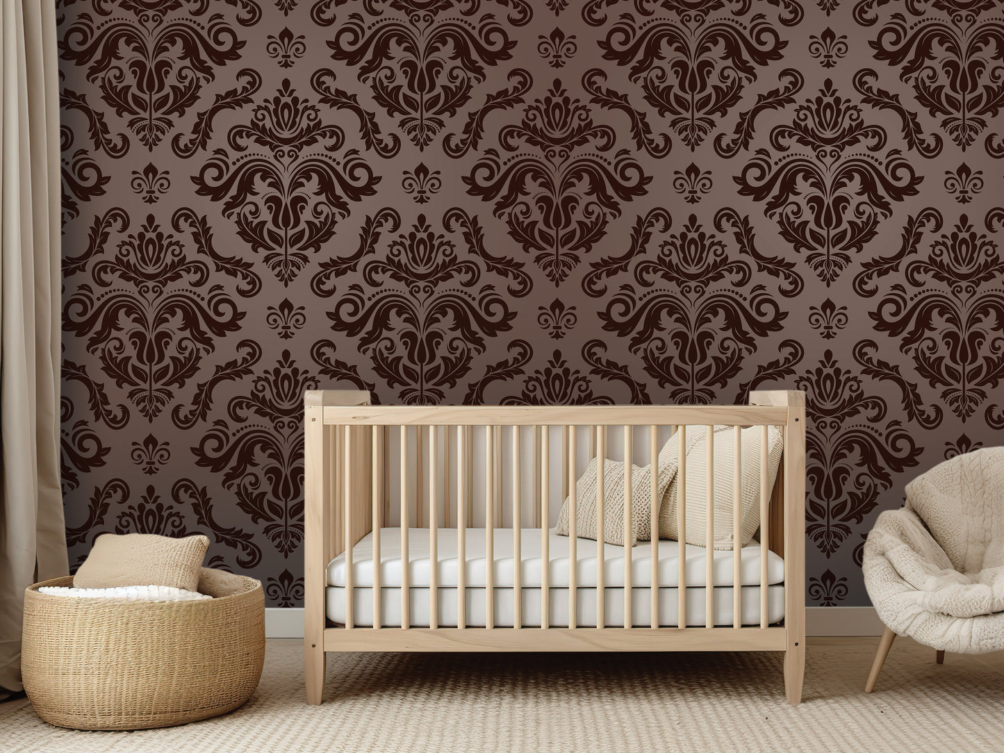 a modern nursery with a wooden crib, a woven basket, and a plush chair. The crib is positioned against a wall with a repeating pattern of brown and black damask designs.