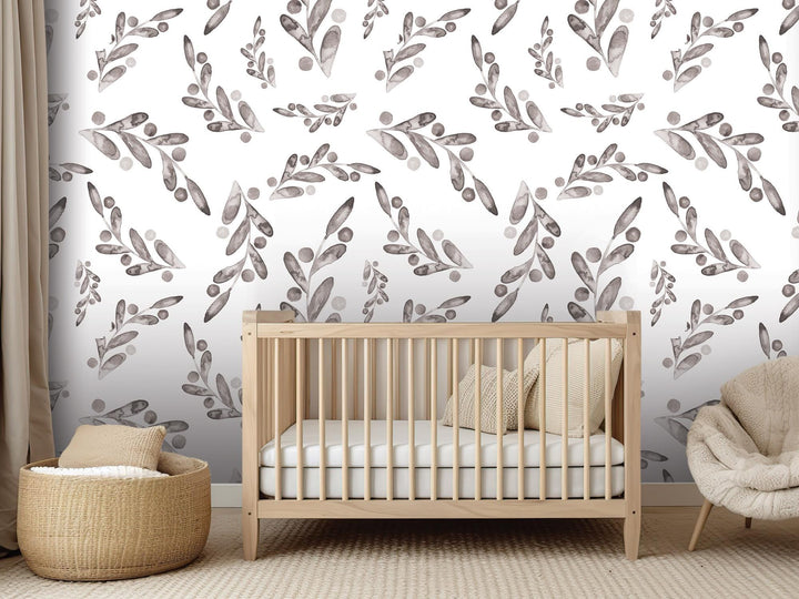 a baby&#39;s room with a crib, chair, and wallpaper