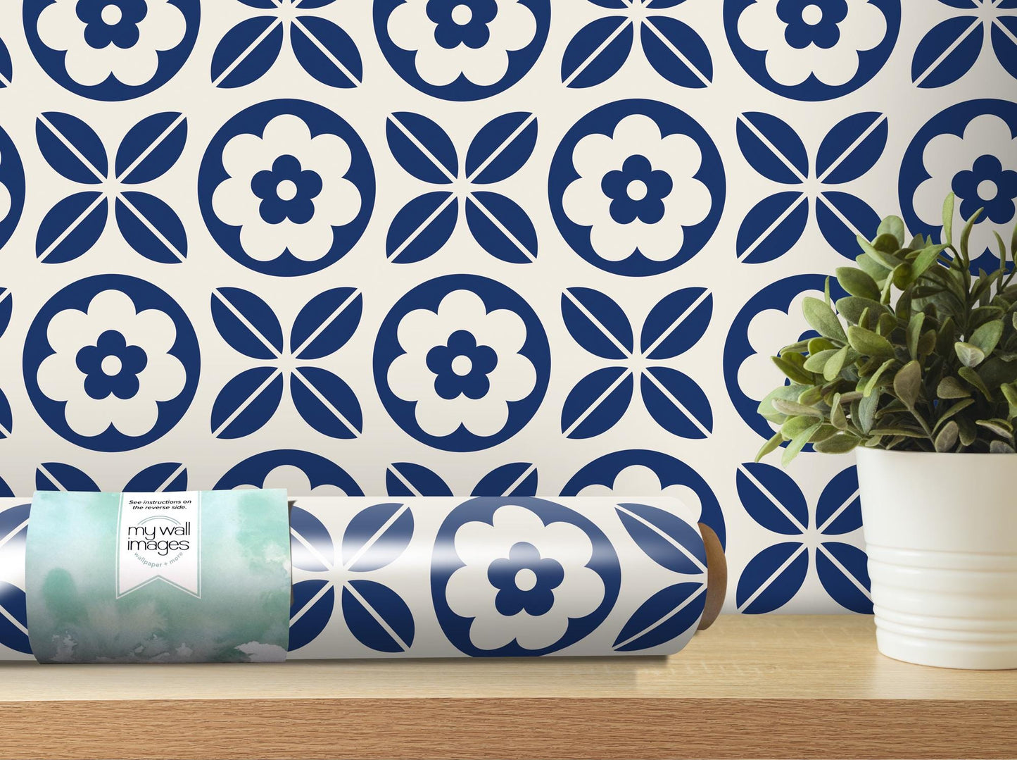 a blue and white wallpaper with a flower design