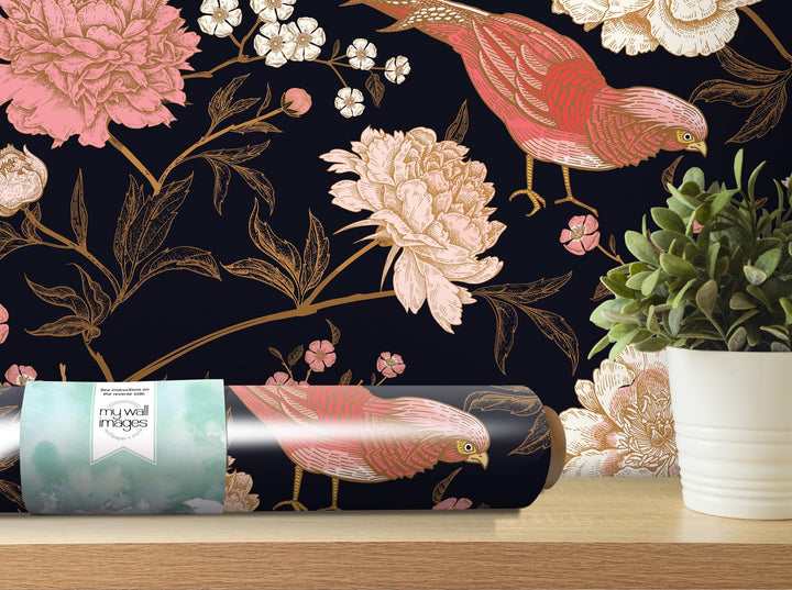 a vase with a flower and a bird on it