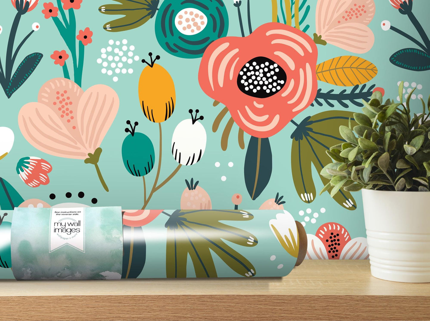 a vase with a plant on a table next to a wallpaper