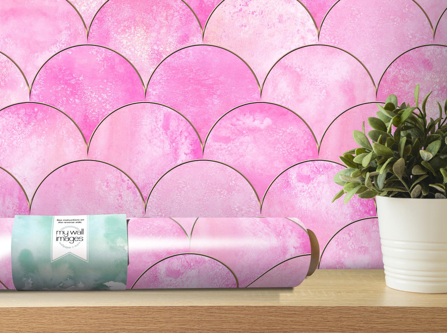 a vase with a plant in it next to a pink wallpaper