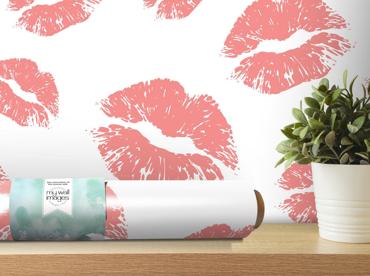 a white vase with a plant in it next to a roll of lipstick