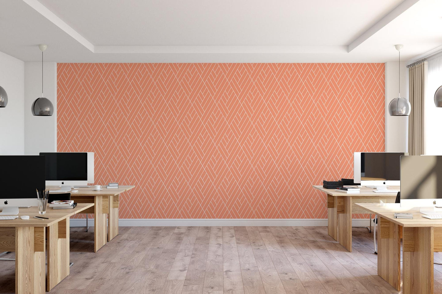 a room with multiple computers on desks and a wall painted orange