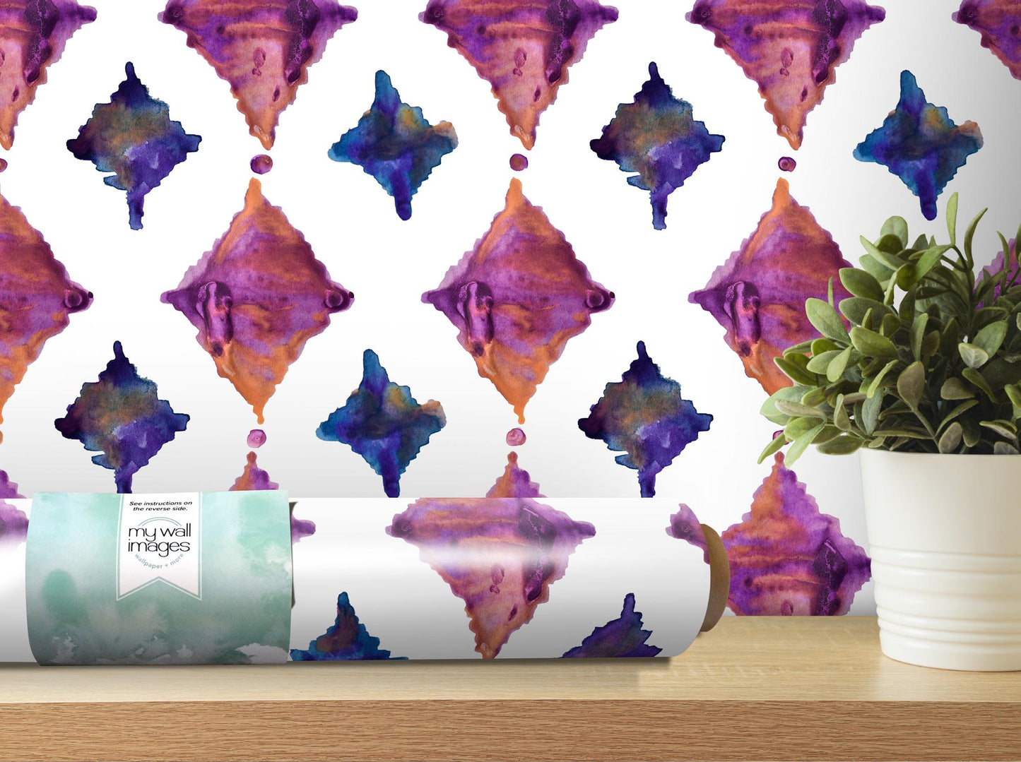 a roll of wrapping paper sitting on a table next to a potted plant