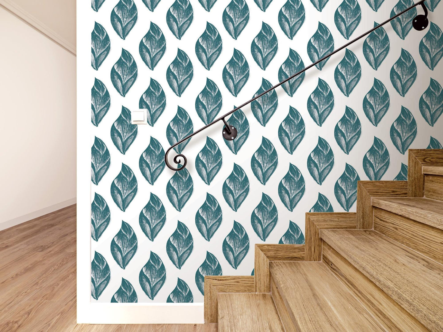 a set of stairs leading up to a wall with a leaf pattern on it