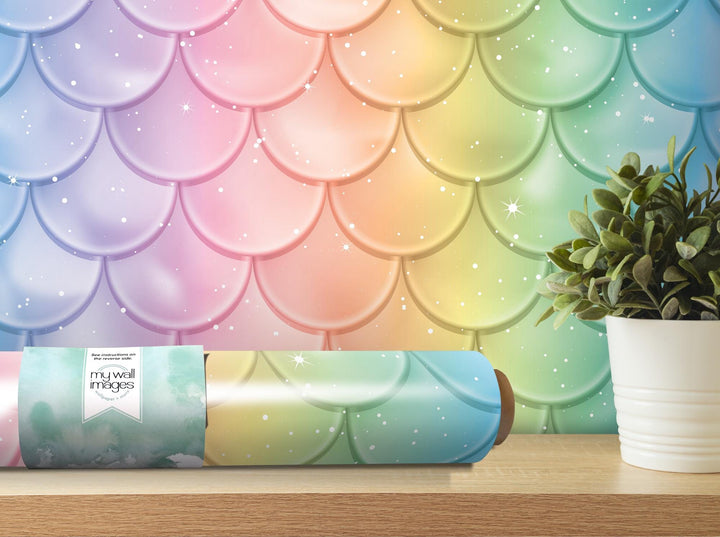 a yoga mat with a rainbow background and a potted plant
