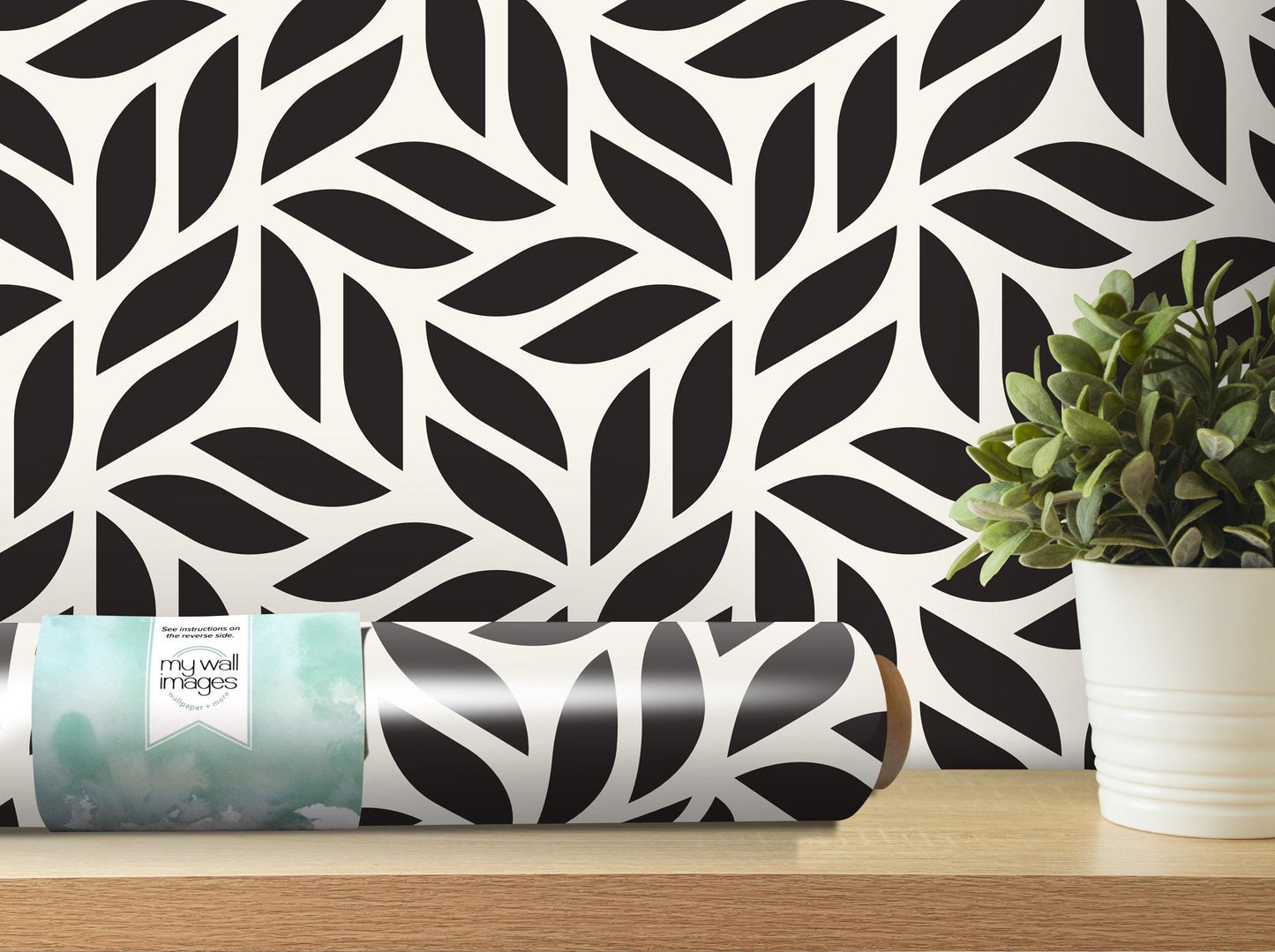 a black and white wallpaper with a plant in a vase