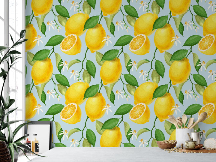 a wallpaper with lemons and leaves on a blue background