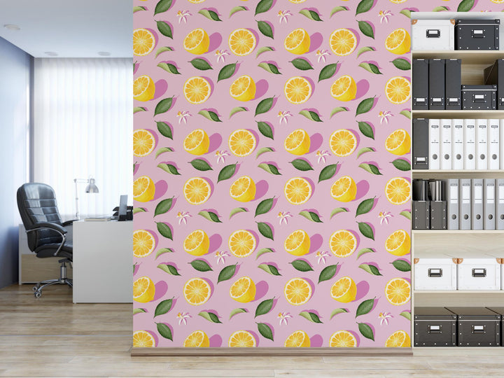 a room with a bookcase and a wall with a pattern of lemons on